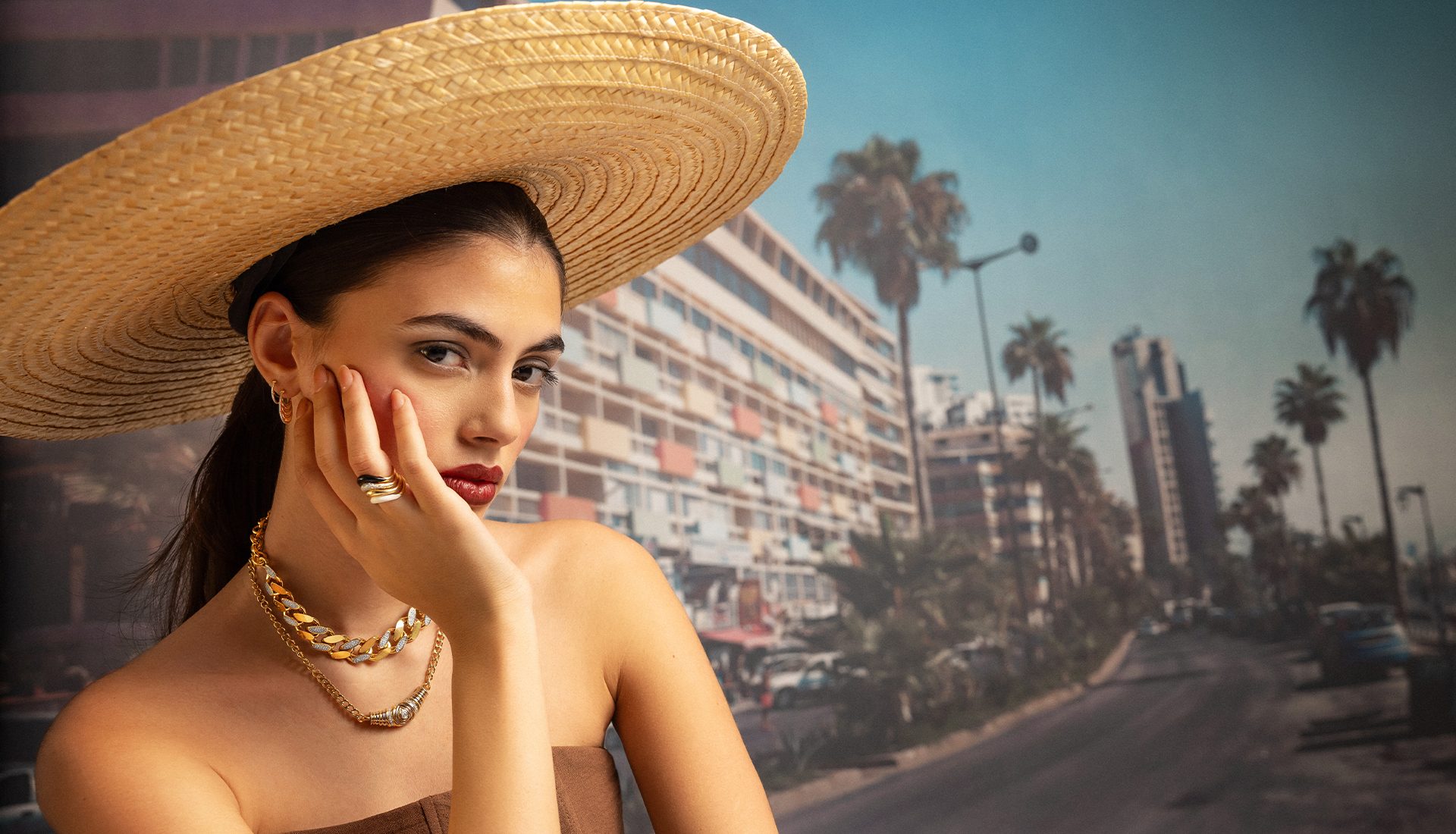 L’Atelier Nawbar campaign portrait, chain necklaces and stacked rings, photographed in Beirut